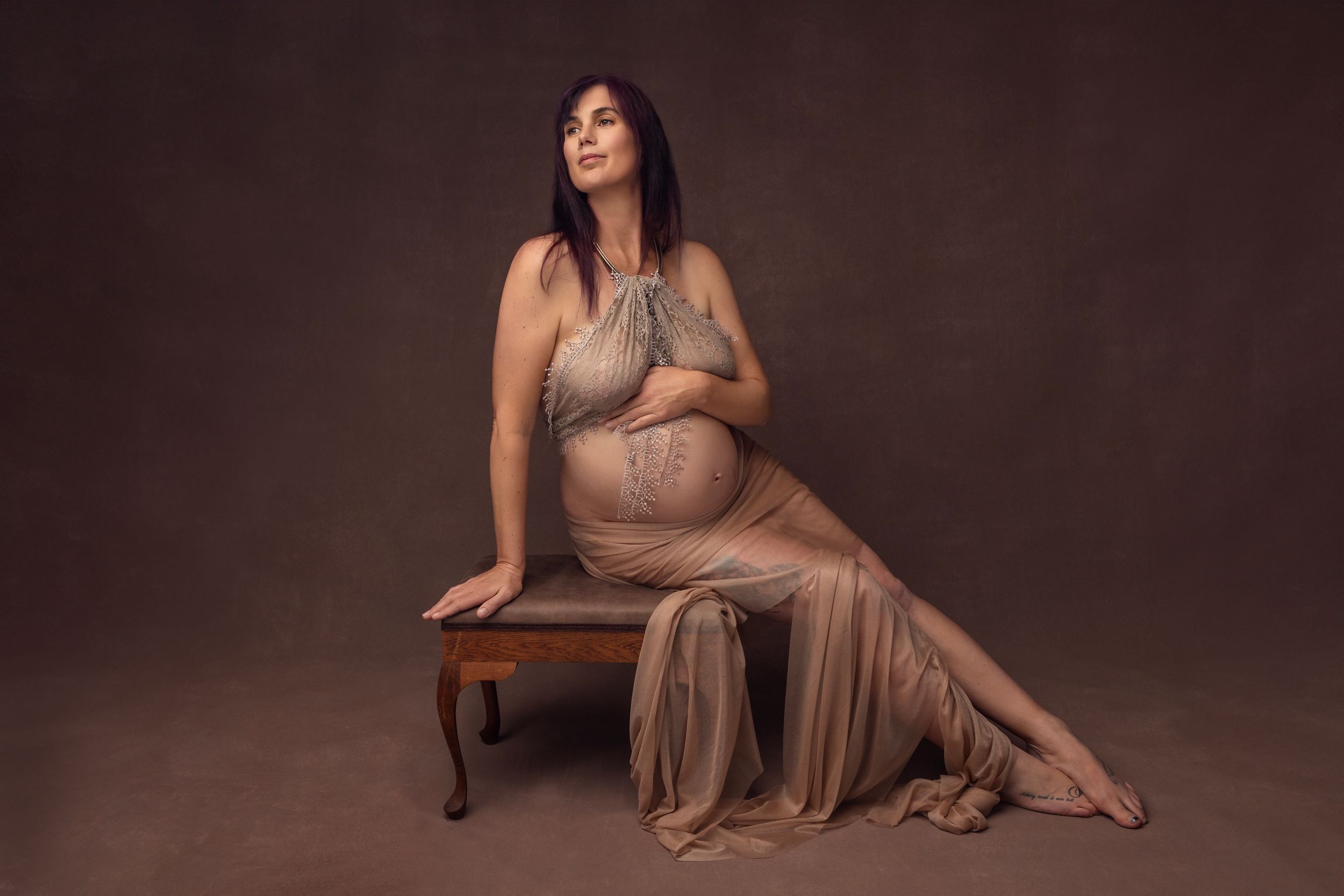 Timeless maternity portrait of a mother-to-be in a North Auckland photography studio.