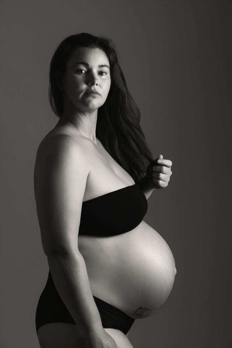 Black and white studio maternity photography celebrating pregnancy and motherhood in Warkworth