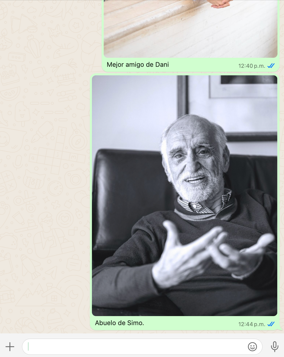 Black and white portrait of an elderly person in a black sweater relaxing in a leather chair with an expressive gesture.