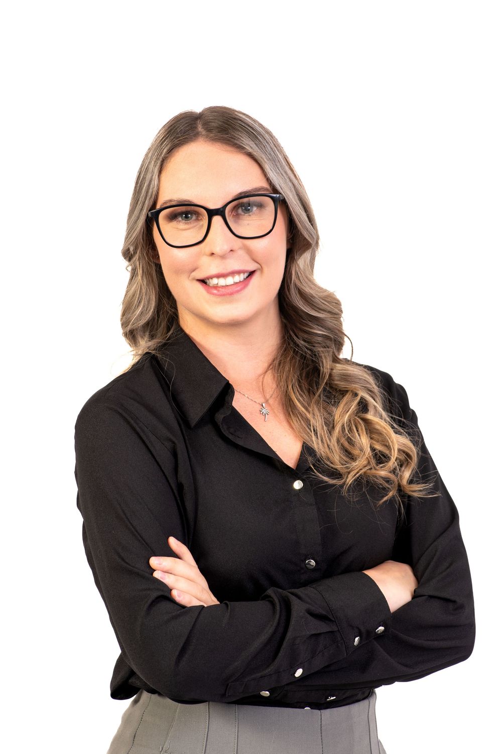 Professional woman in black button-down shirt and glasses poses in multiple headshots against white background.