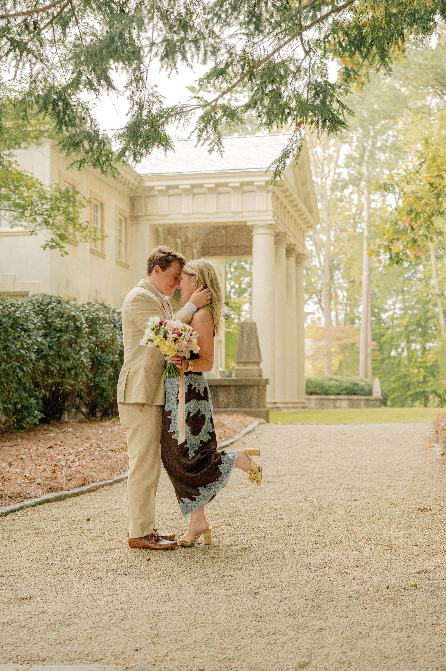 Romantic engagement photo sequence in garden pavilion setting.
