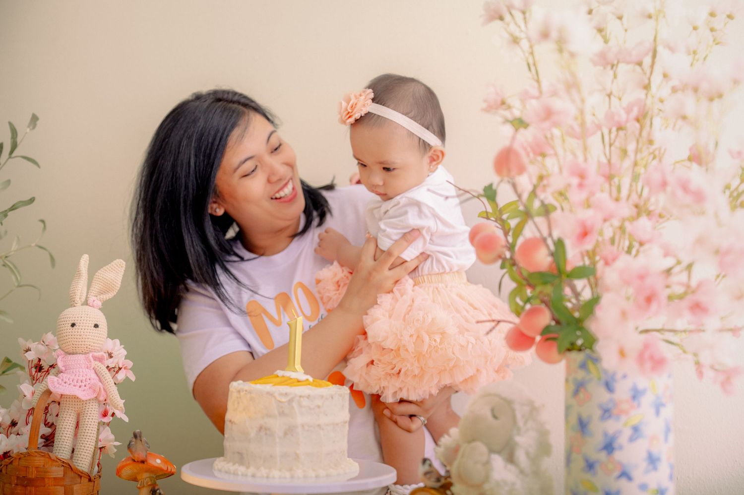 Family celebration scene with pink cherry blossoms and yellow gingham backdrop.