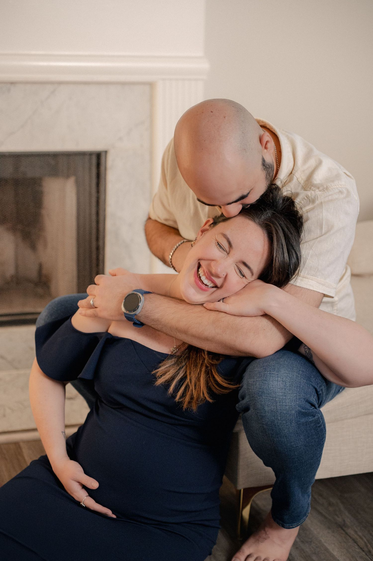 Intimate moment captured in a bright, minimalist living room setting.
