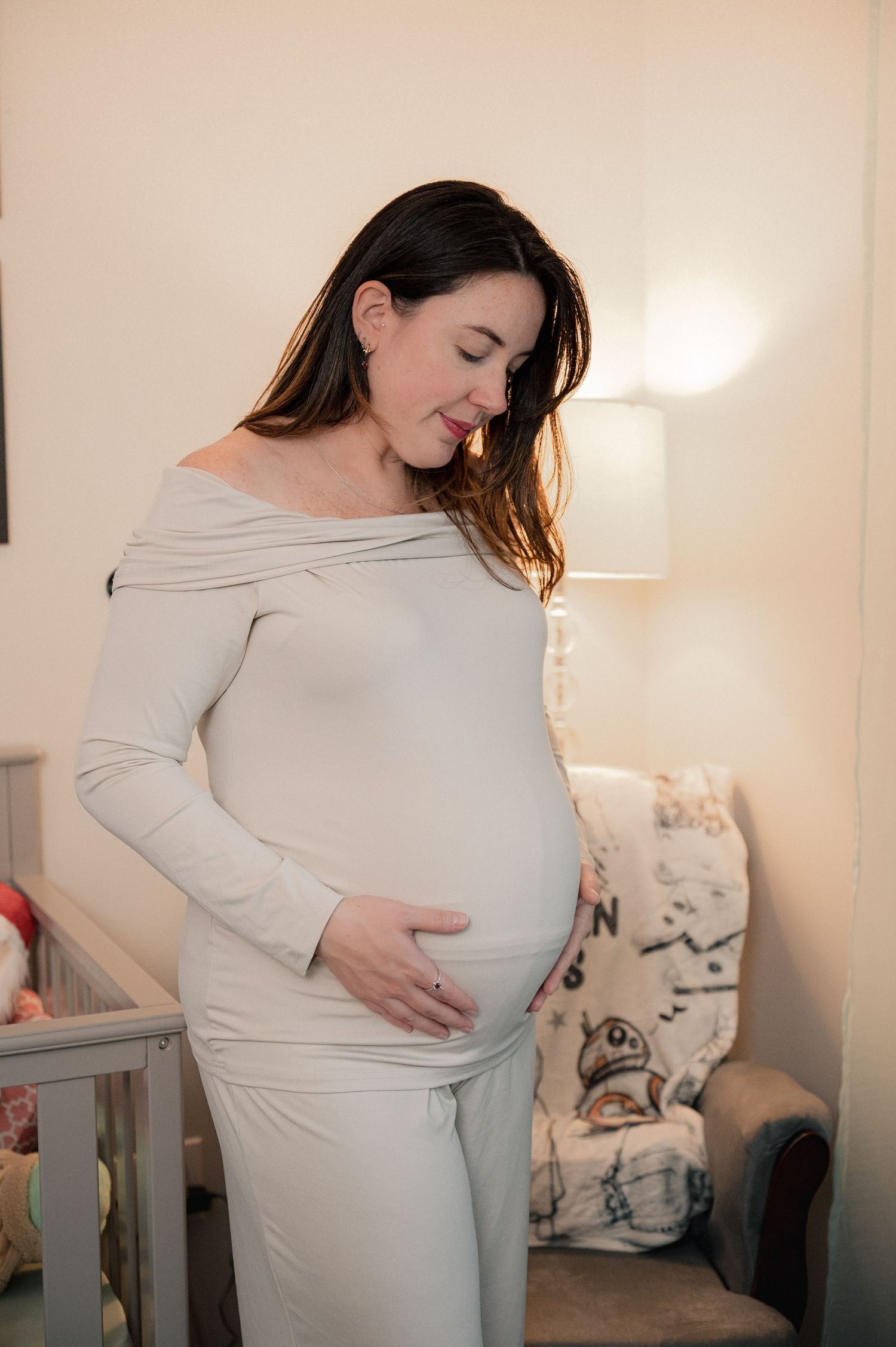A collection of artistic maternity photos showing a woman in a light beige dress against neutral walls.