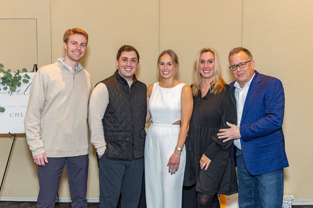 Group photo of celebrants posed together at an engagement party at Arturo's restaurant in Westborough, MA.  Event photography.