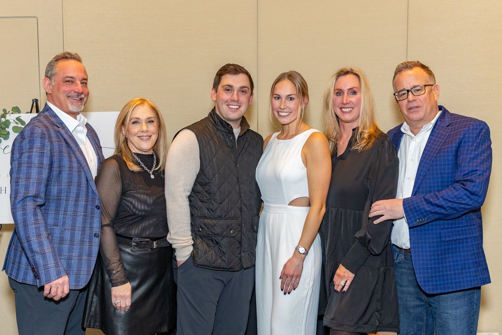 Group photo of formal event attendees at an engagement party at Arturo's restaurant in Westborough, MA.  Event photography.