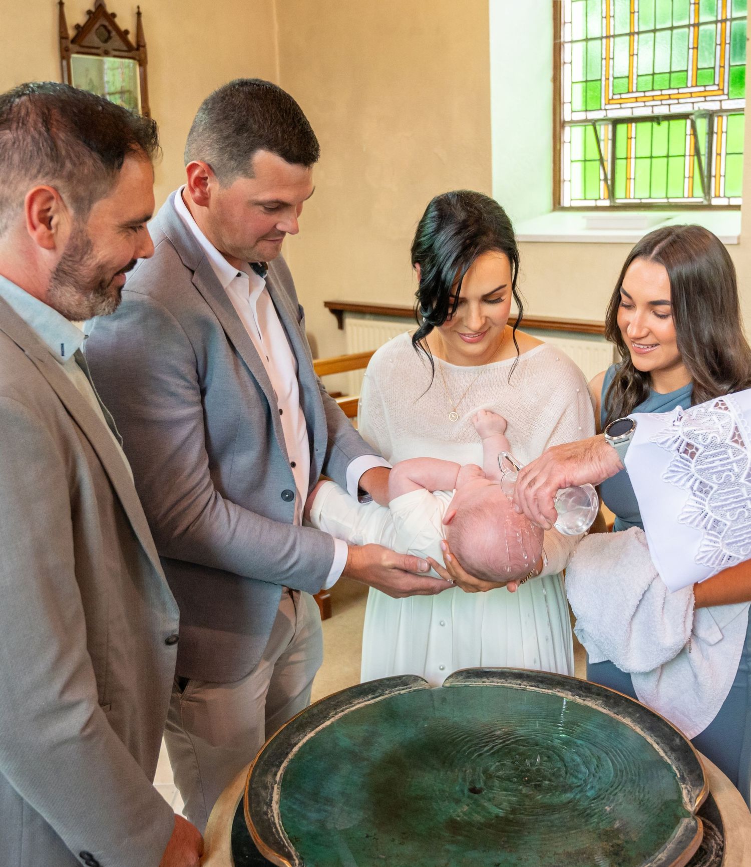 Louise and Jerh christening baby Jake in Knocknagree Church, County Cork.