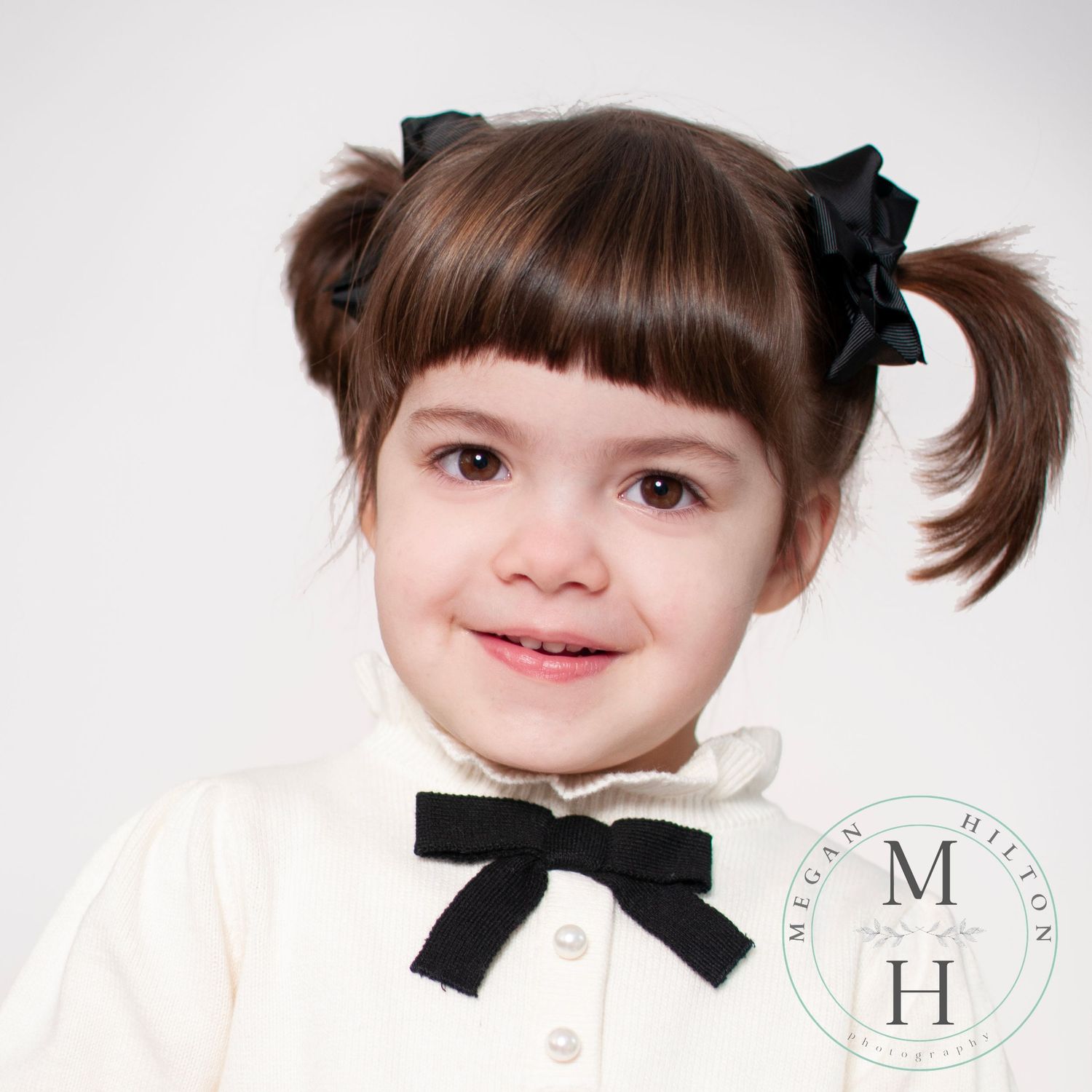 Close up headshot of three year old girl