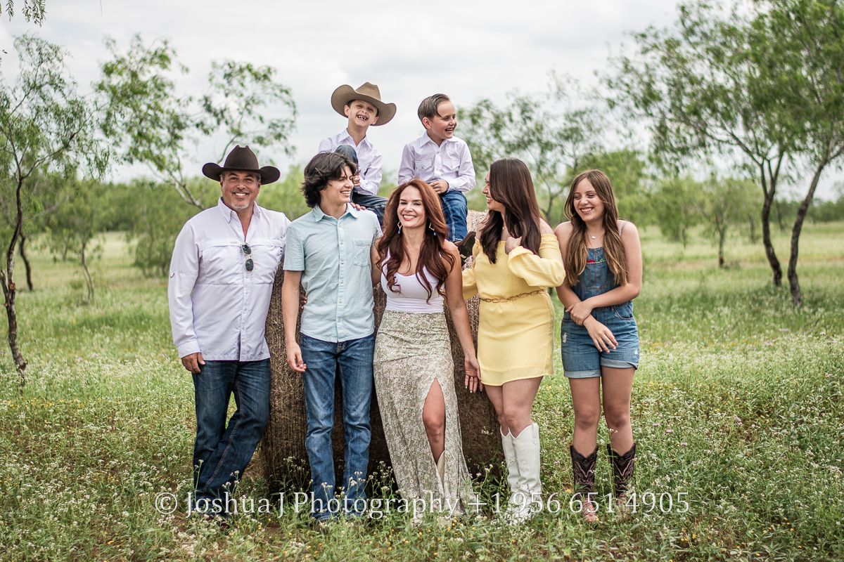 Family photos with a hay bale.
