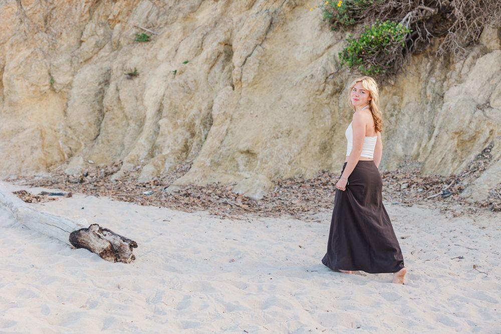 Outdoor graduation portraits of a Royal High School graduate at Leo Carrillo State Beach, Los Angeles County.
