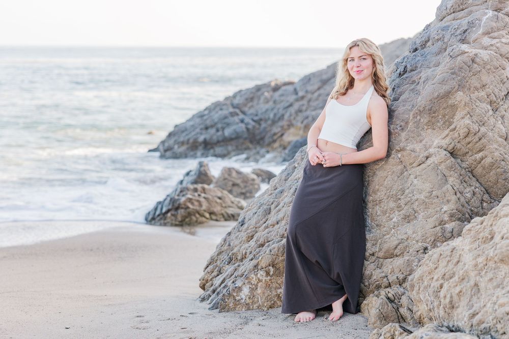 Outdoor graduation portraits of a Royal High School graduate at Leo Carrillo State Beach, Los Angeles County.