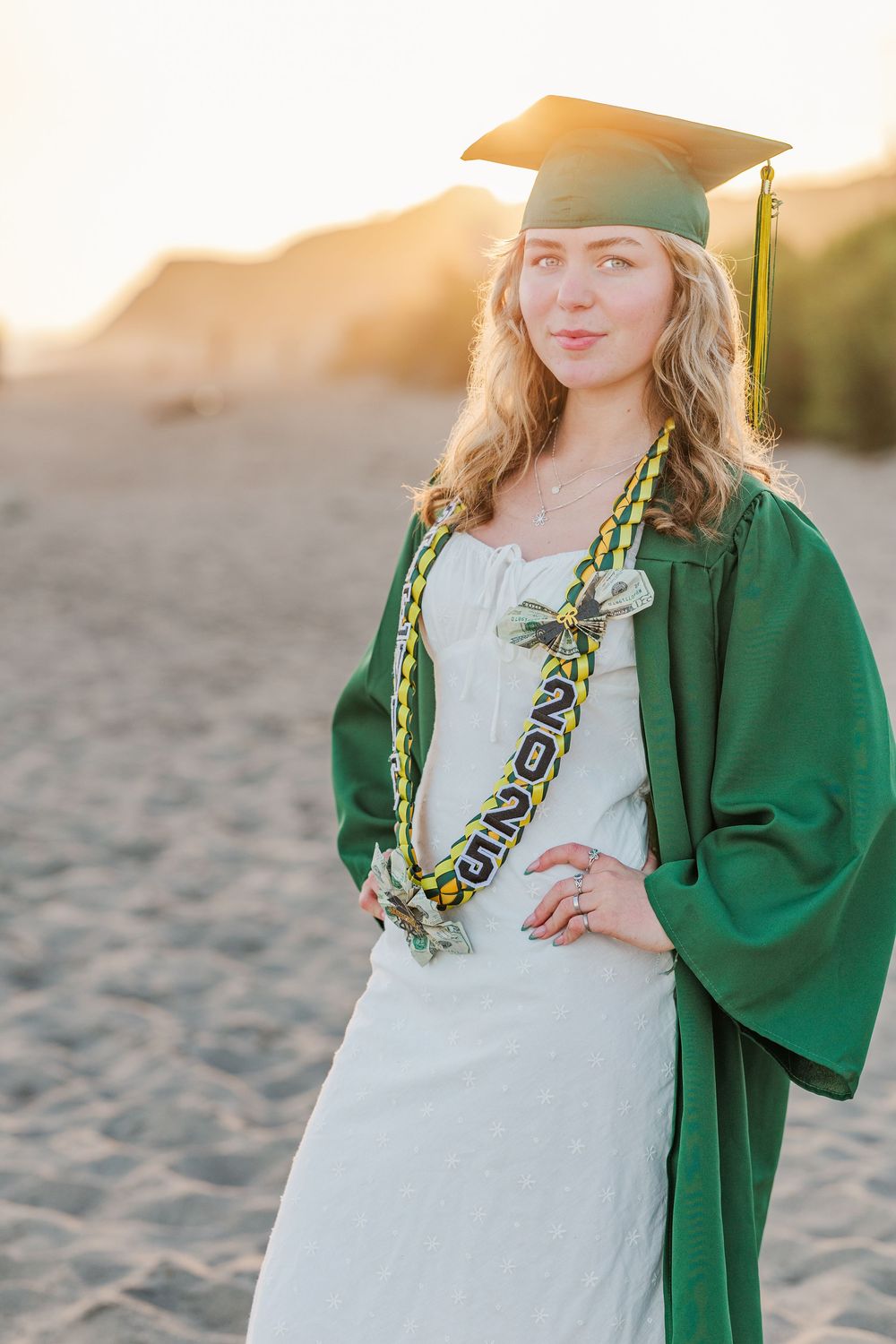 Royal High School graduate posing at Leo Carrillo State Beach in Los Angeles County for stunning outdoor graduation portraits.