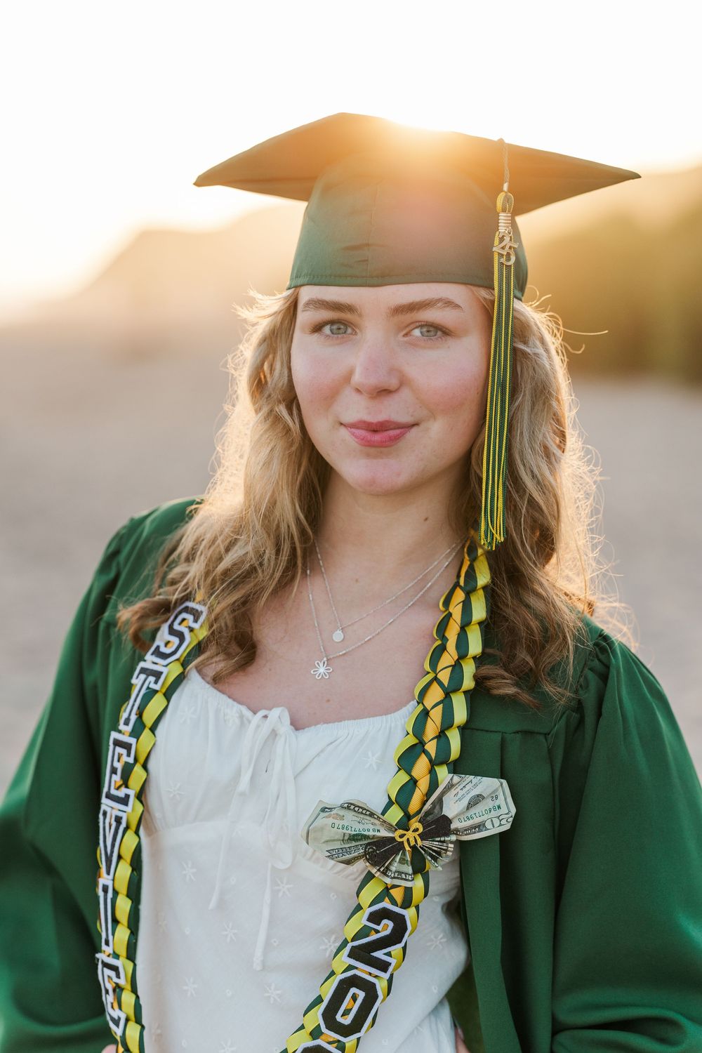 Royal High School graduate posing at Leo Carrillo State Beach in Los Angeles County for stunning outdoor graduation portraits.