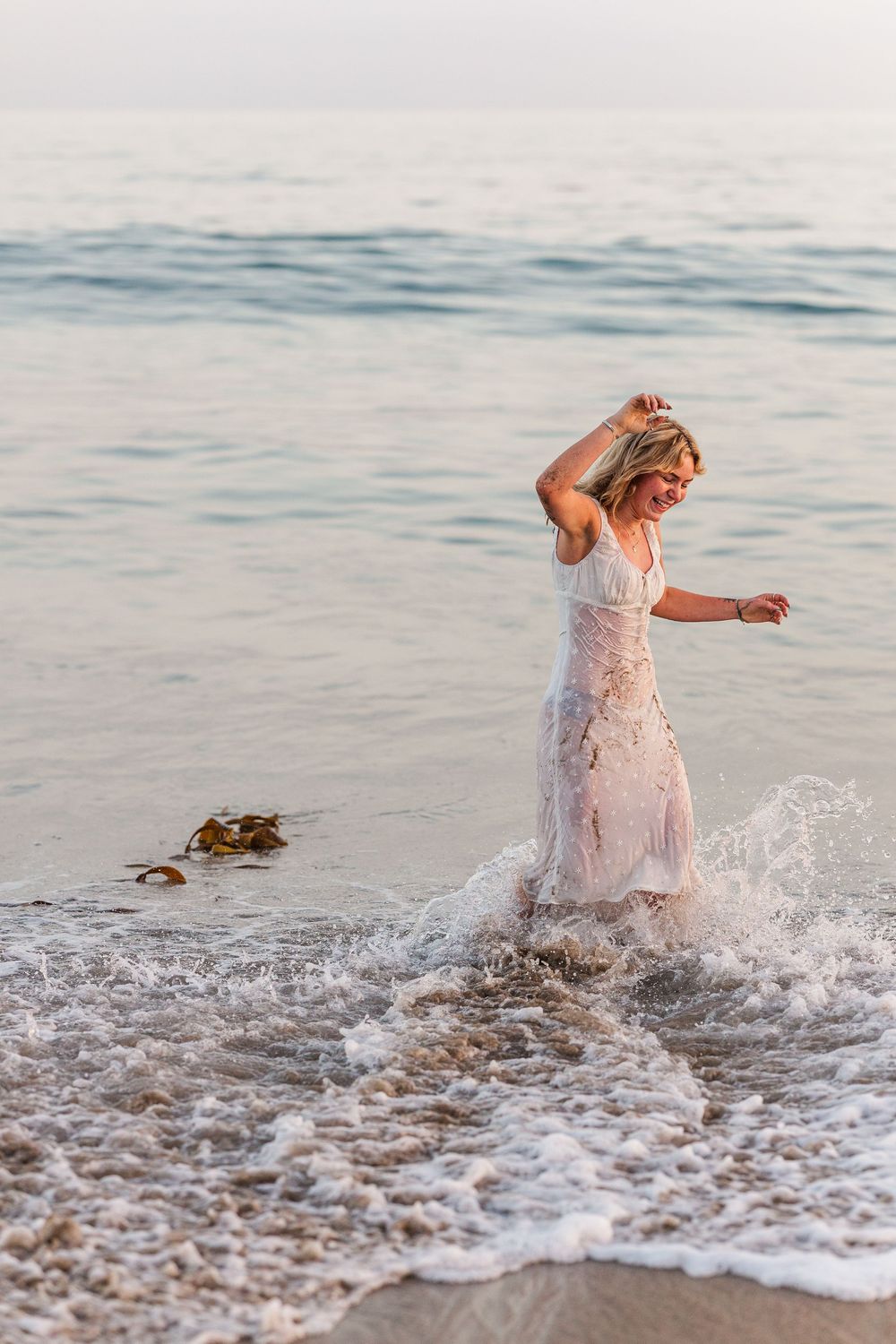 Royal High School graduate posing at Leo Carrillo State Beach in Los Angeles County for stunning outdoor graduation portraits.