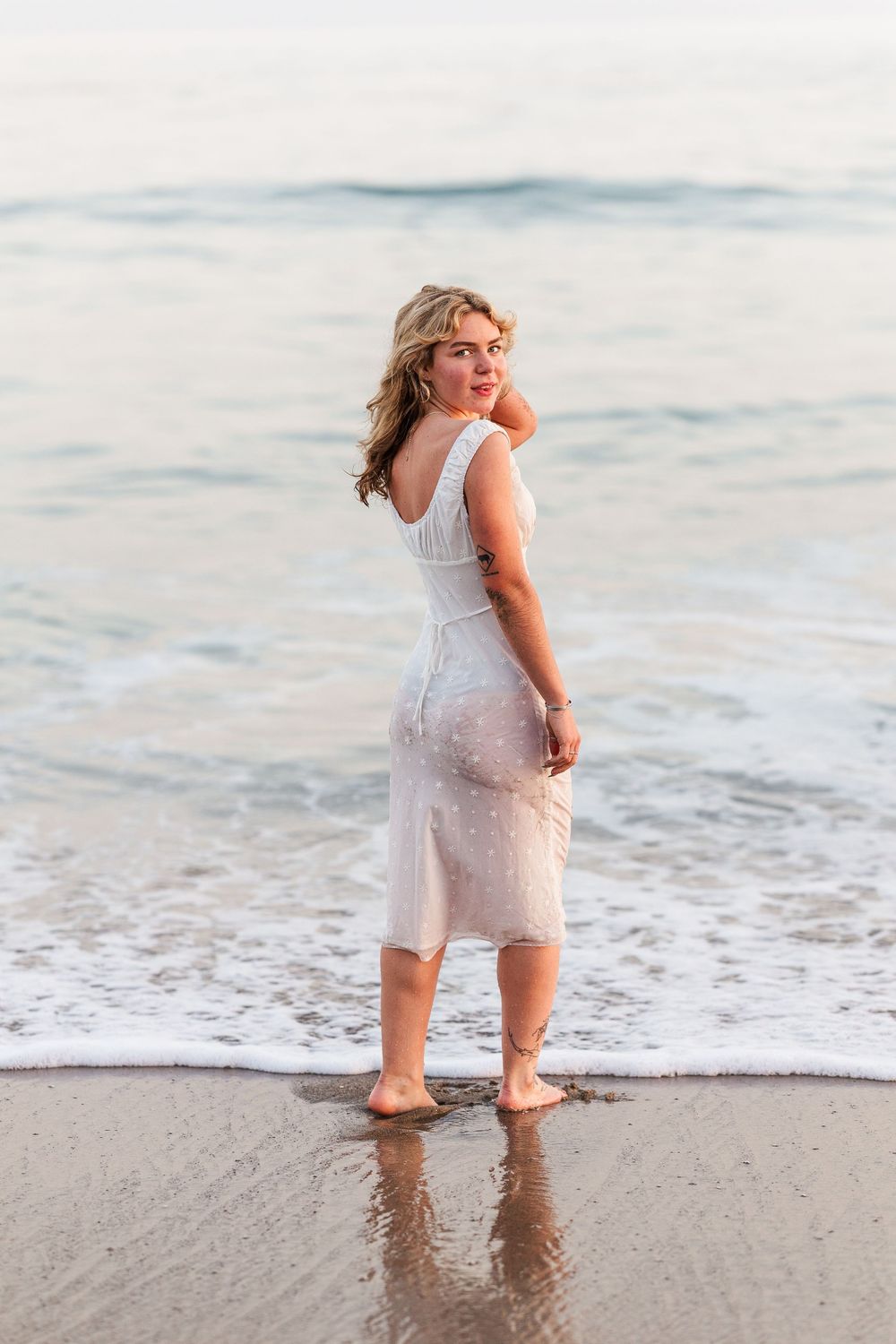 Outdoor graduation portraits of a Royal High School graduate at Leo Carrillo State Beach, Los Angeles County.
