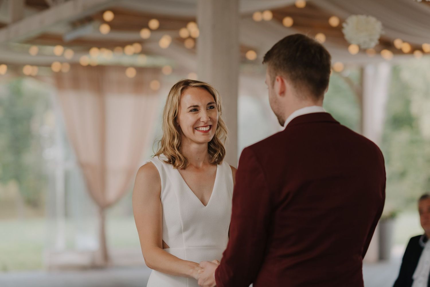 Wedding couple shares intimate moments during their photoshoot under string lights.