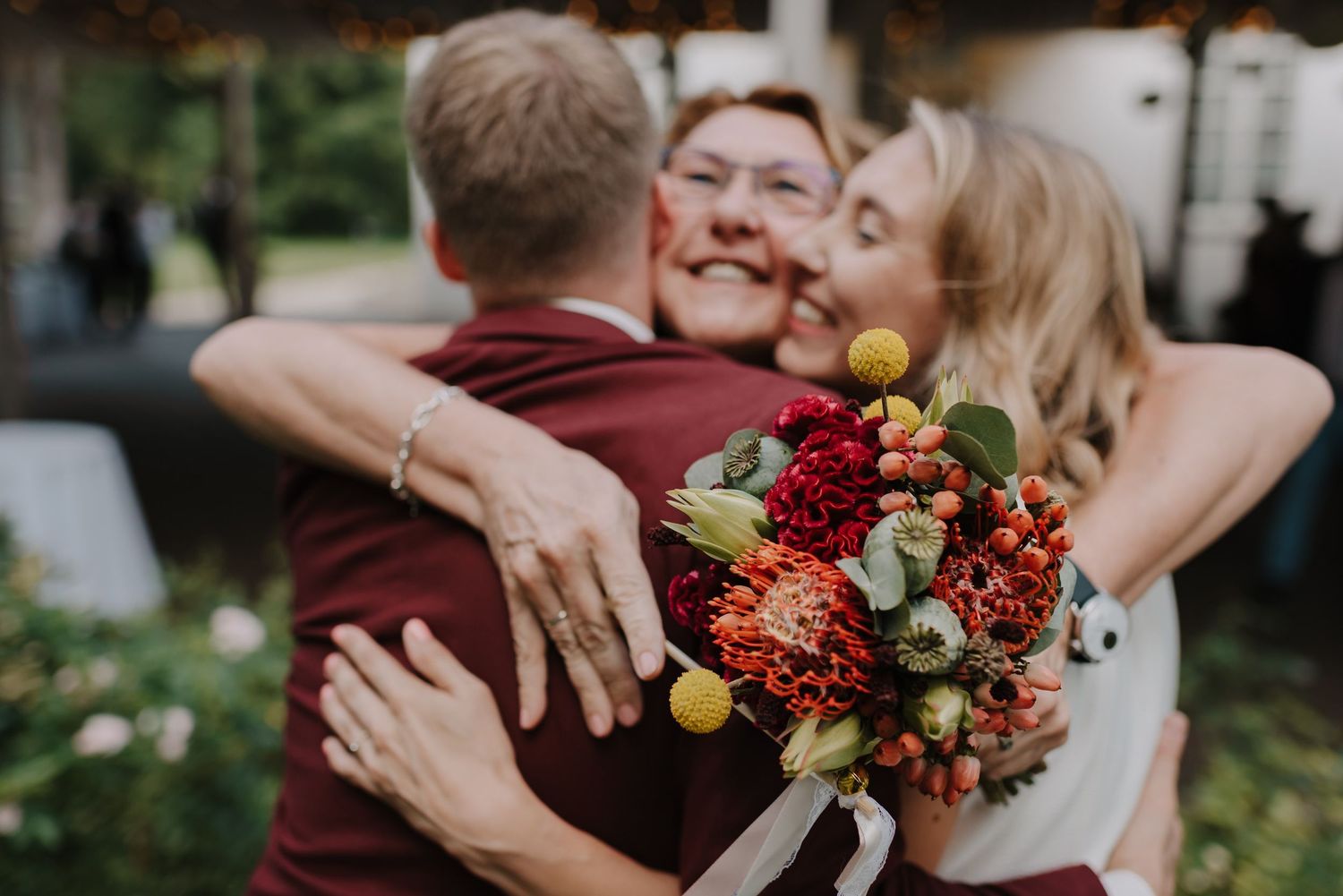 Romantic wedding photo series featuring autumn-colored bouquet and candid emotional moments.