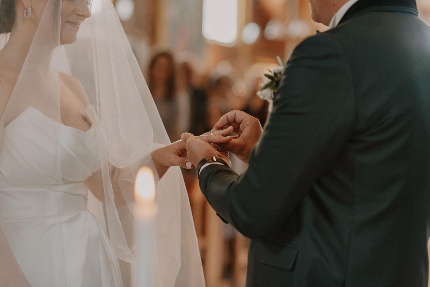 Wedding ceremony moment with couple exchanging rings during intimate ceremony.