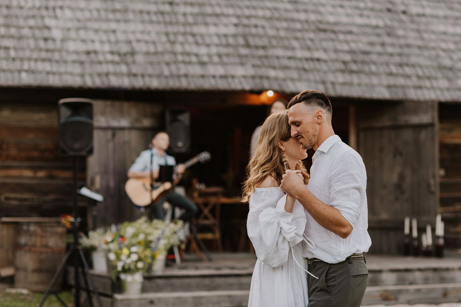 Romantic rustic barn wedding with live music and dancing at sunset.