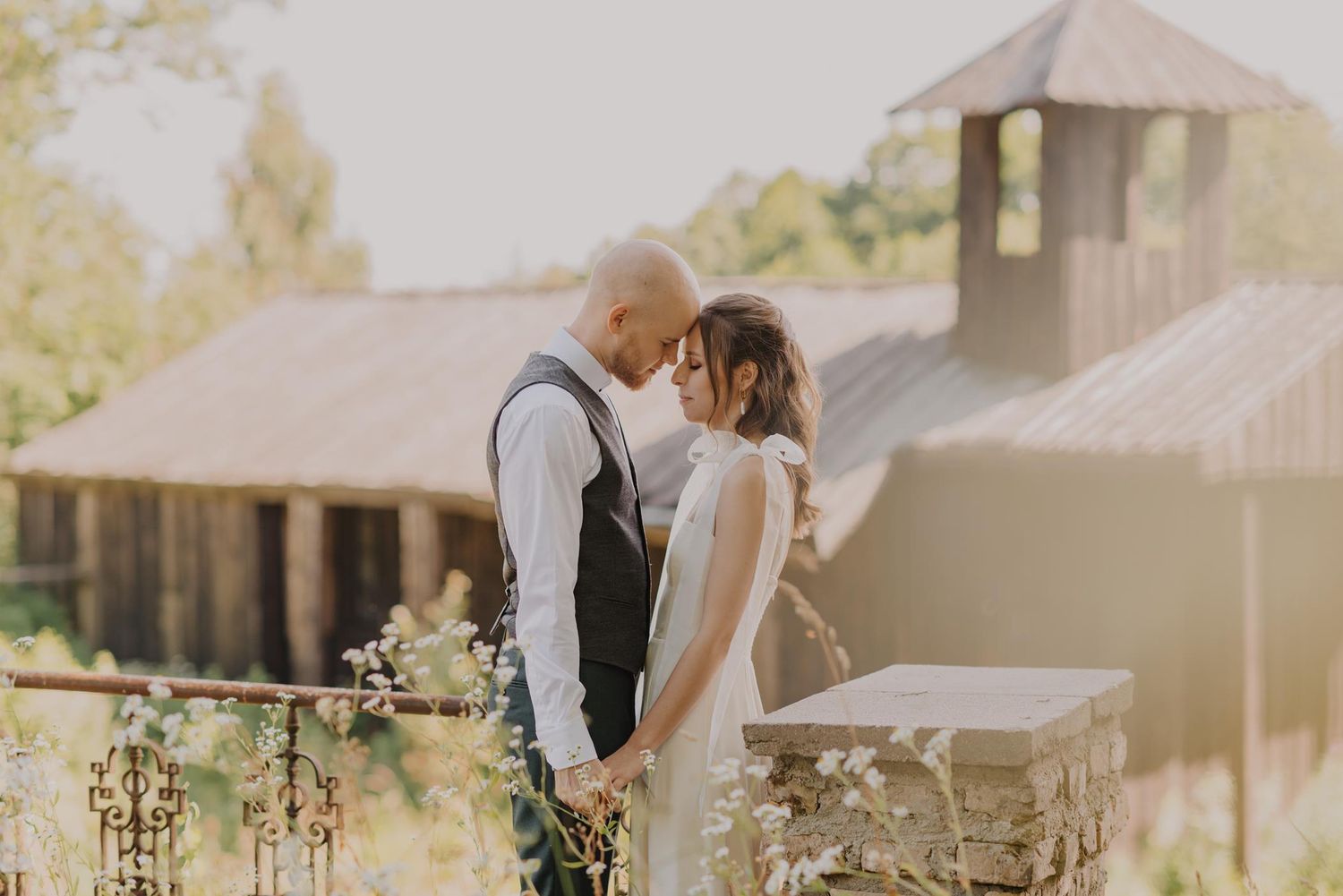 Joyful wedding celebration scene with soft natural sunlight and white decor.
