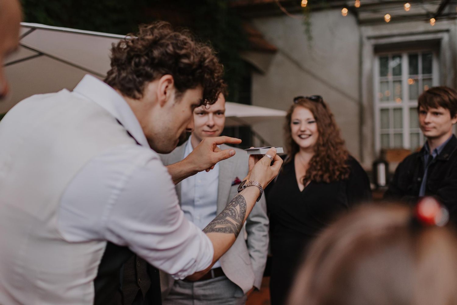 Candid reception moment showing guests dancing and celebrating at wedding party.