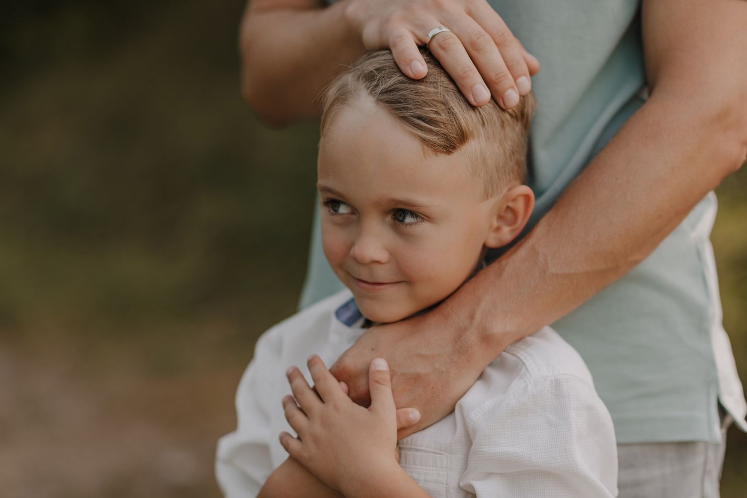 Happy children giggling and bonding during an outdoor photoshoot.