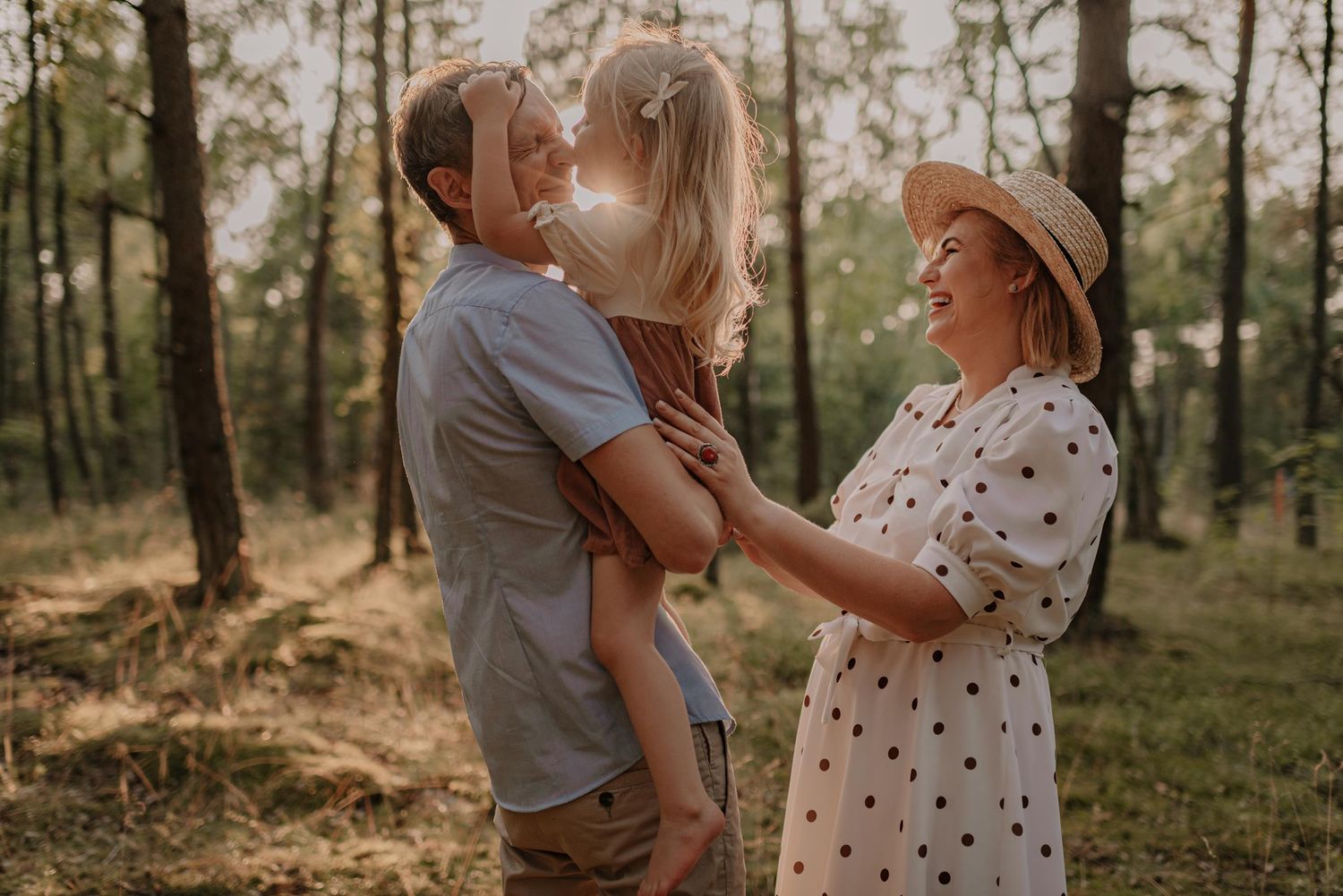 Natural light filters through forest trees during romantic sunset photo session.