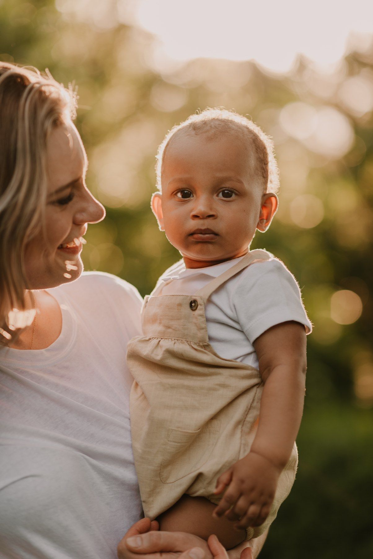 Intimate outdoor portrait session with soft golden lighting and natural expressions.
