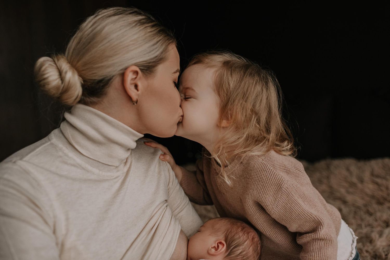 Intimate black and white portraits capturing tender family moments.
