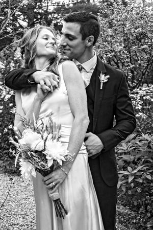 Black and white wedding portraits showing intimate moments between couple.