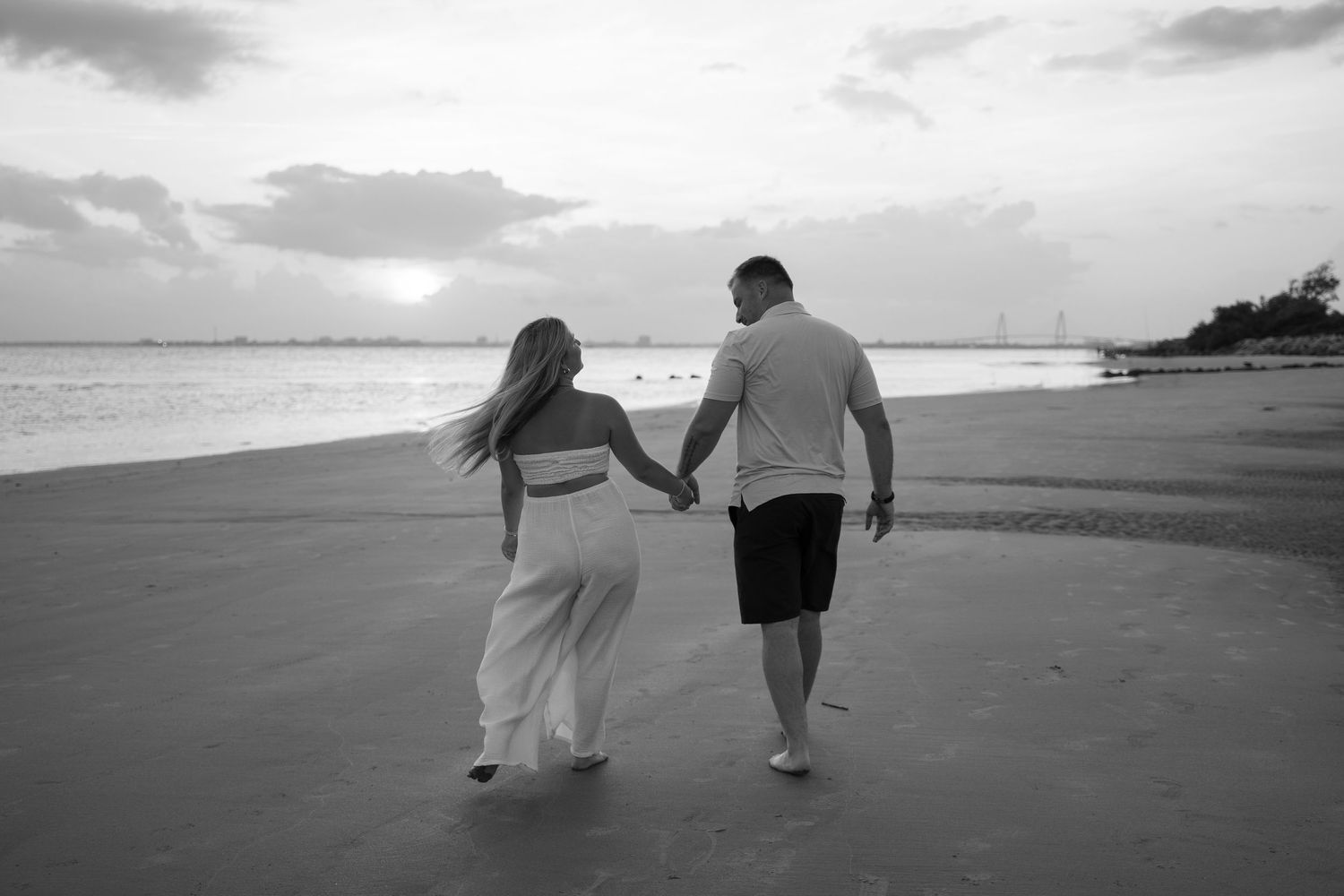 Sunset beach proposal captured by a destination proposal photographer.