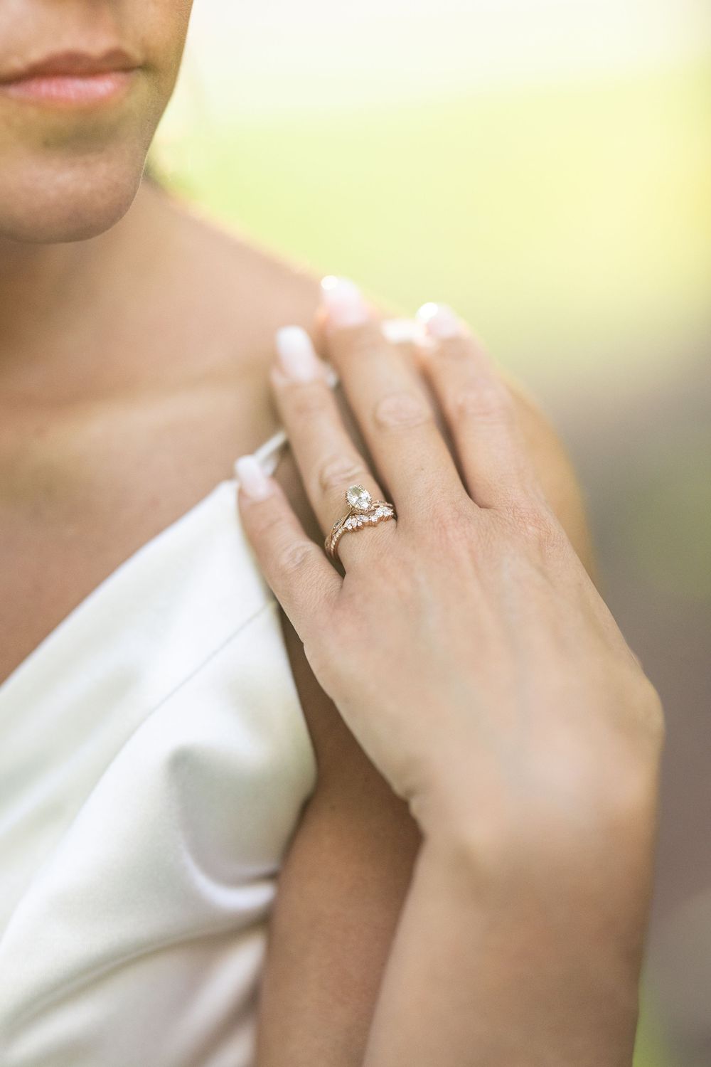 Close-up series showing a diamond engagement ring on a hand against a soft, blurred background.