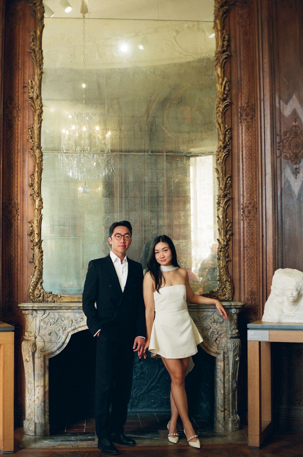 Artistic sequence of reflections in ornate gold-framed mirrors within an elegant room interior. Paris film photoshoot.