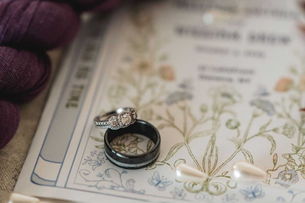 Detailed shot of ornate wedding invitation with delicate floral designs.