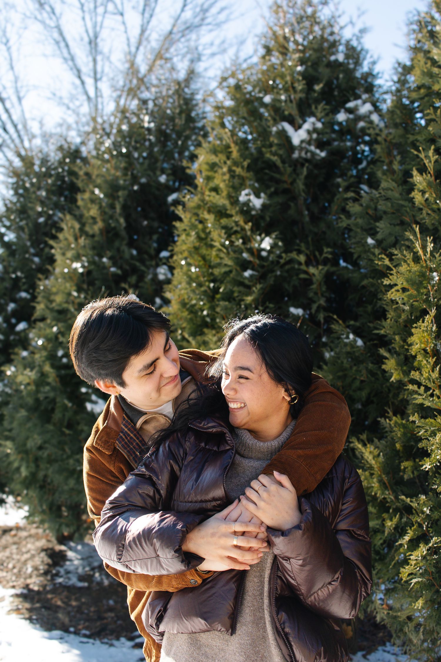 A romantic engagement photo session in a golden marsh field during sunset.