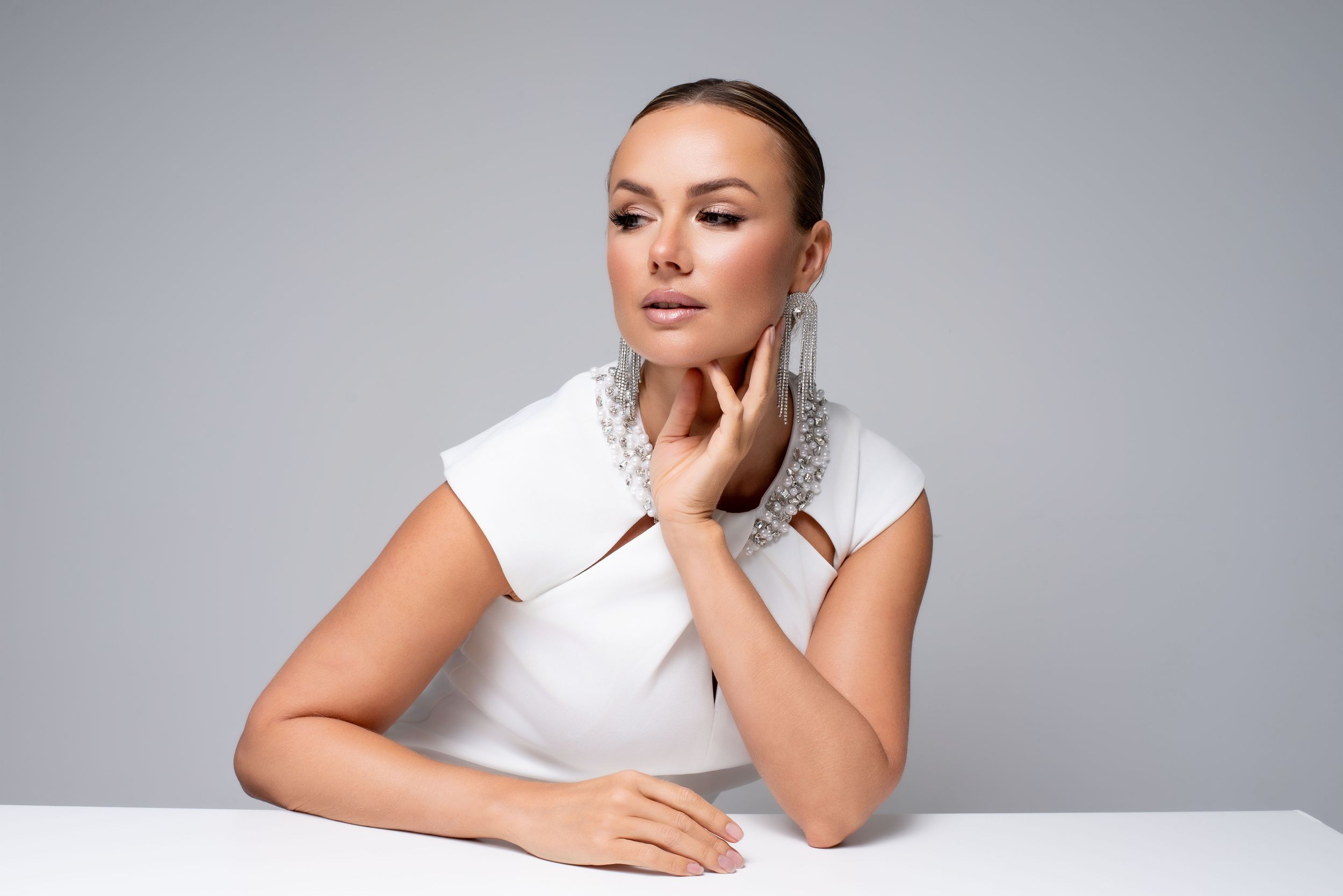 Woman over 40 enjoying an empowering studio photoshoot experience.