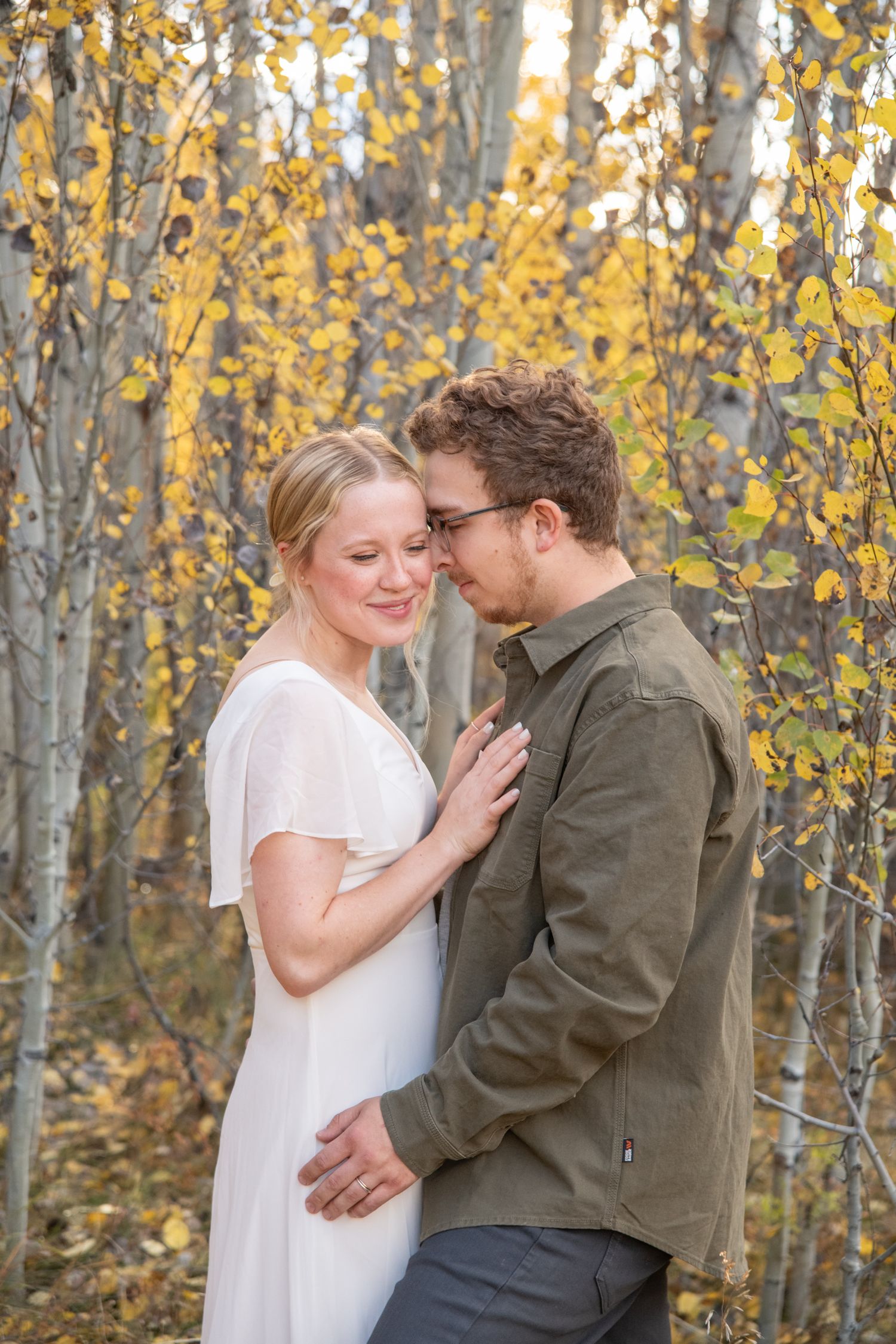 Vail engagement photo session with aspen leaves in the Colorado mountains