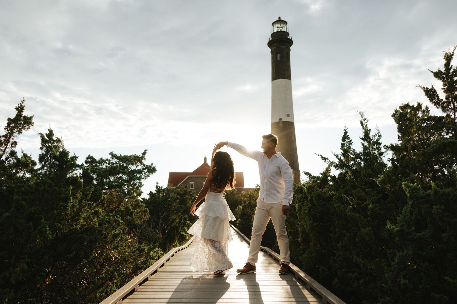Couple dance at Robert Moses State Park for Long Island engagement photos