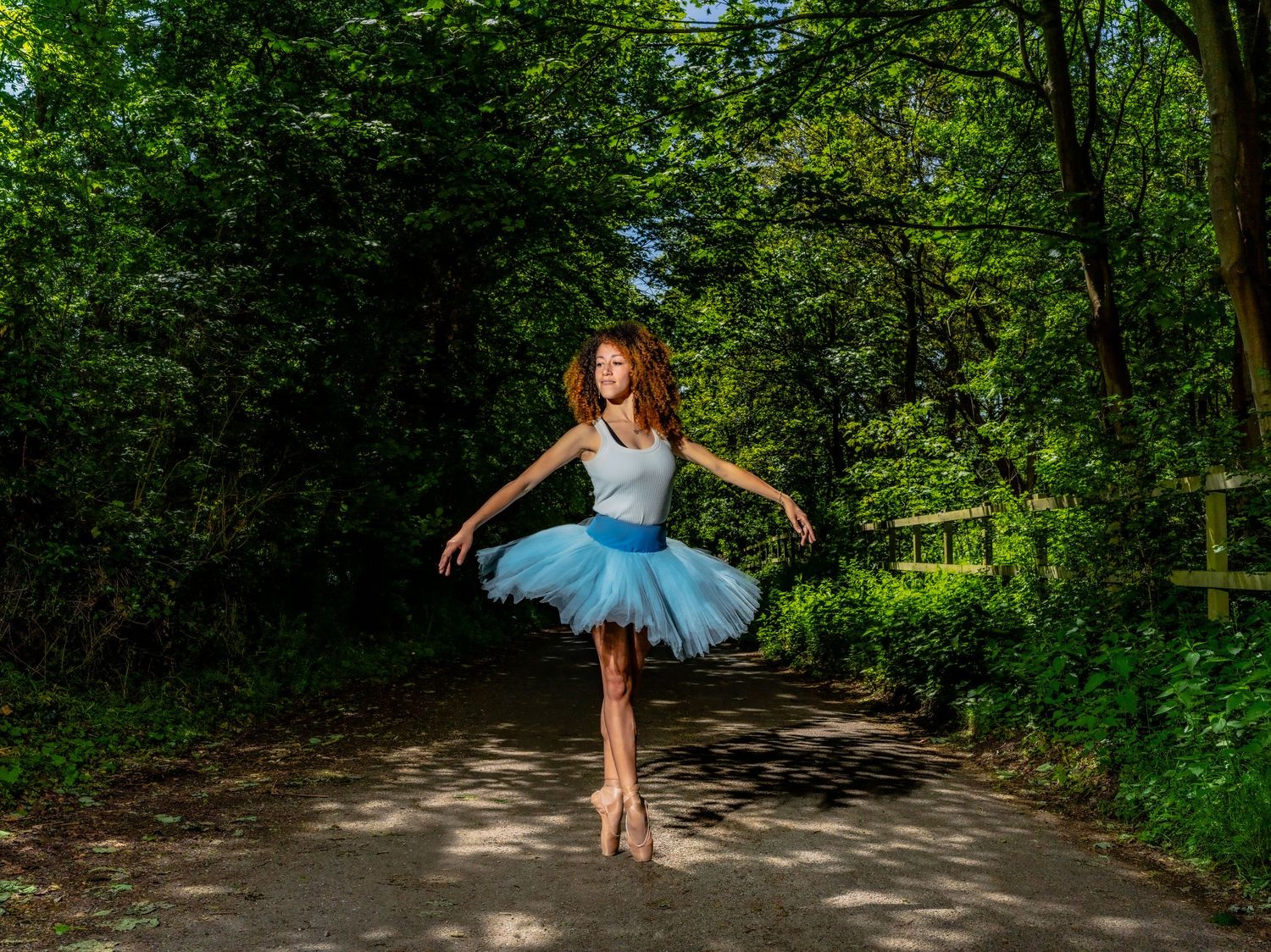 Editorial portrait of dancer Kanika Carr performing outdoors, Suffolk