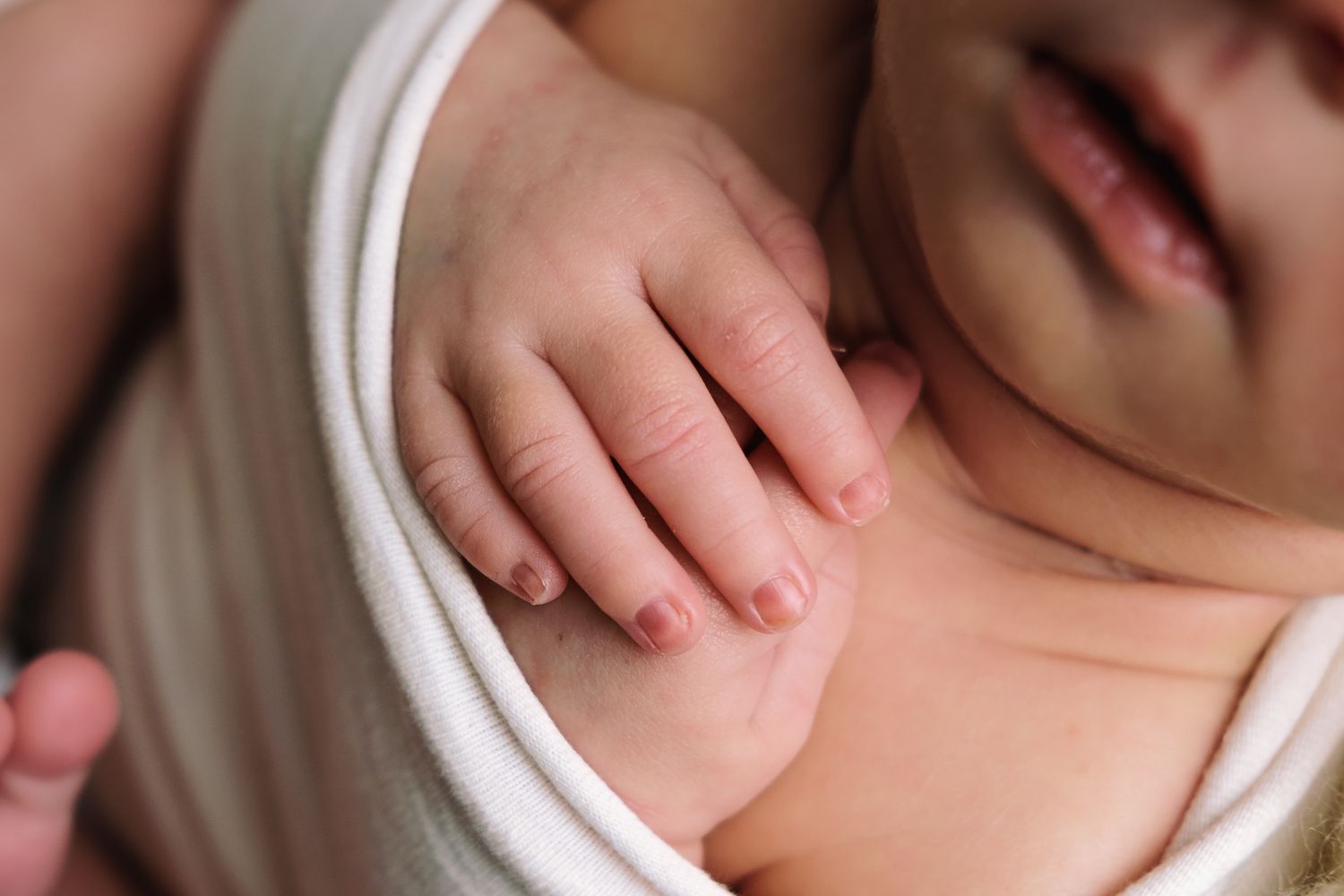 Tiny newborn hands, new beginnings