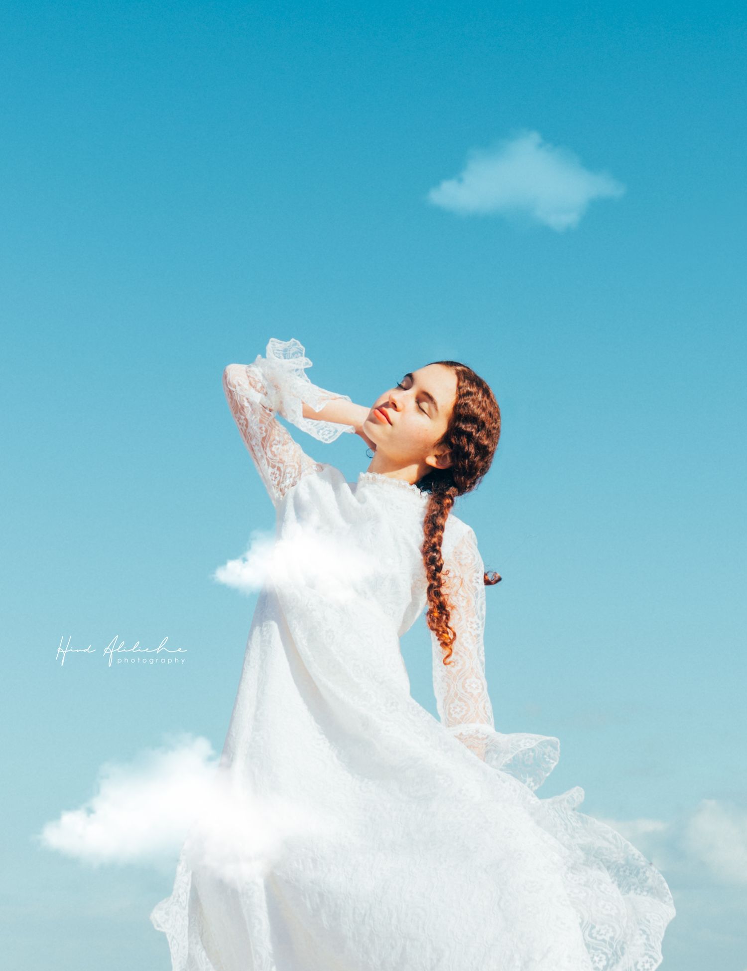 Portrait of a woman in a blue sky, Natural light. Portrait Photography session. Outdoor photography, fine art