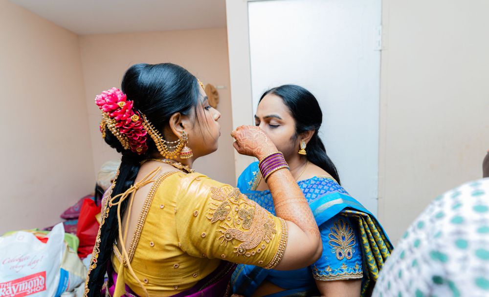 Traditional Indian pre-wedding preparation scene with decorative attire.