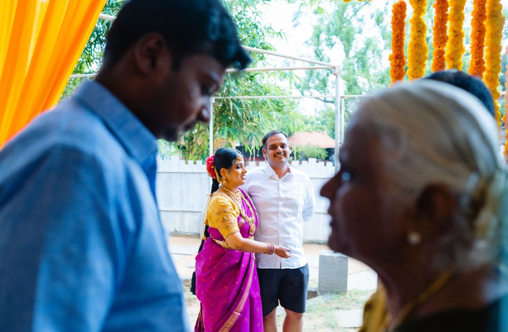 People gathered outdoors during a celebratory event with bright decorations.