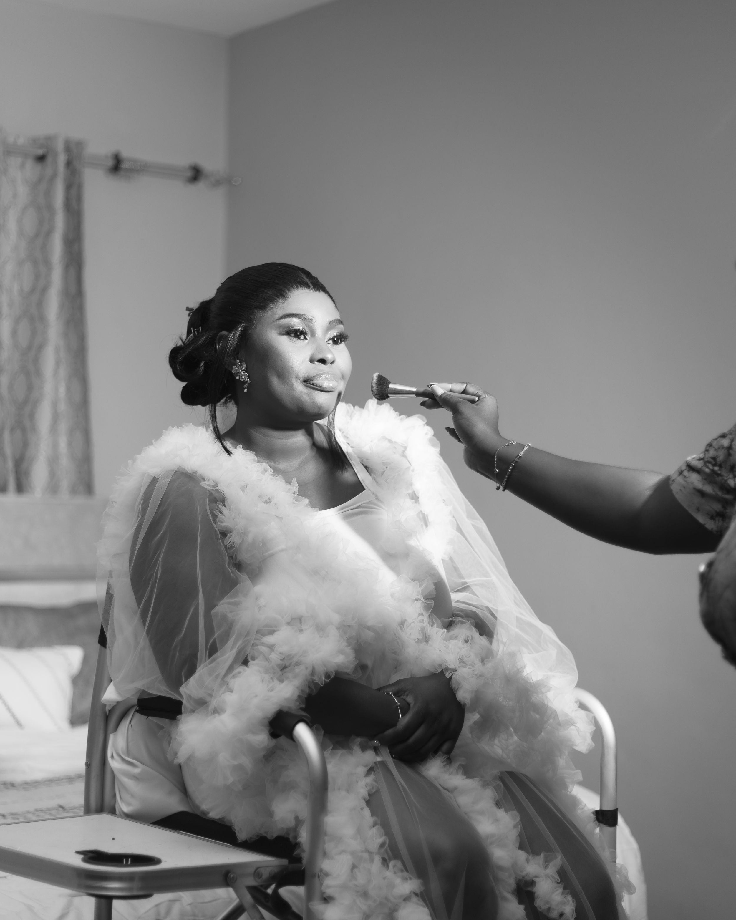Someone blows vapor rings in dramatic black and white photo sequence showing smoke formations.