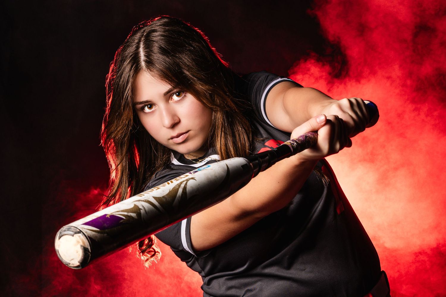 Dramatic sports portrait sequence with red smoke effects and baseball bat.