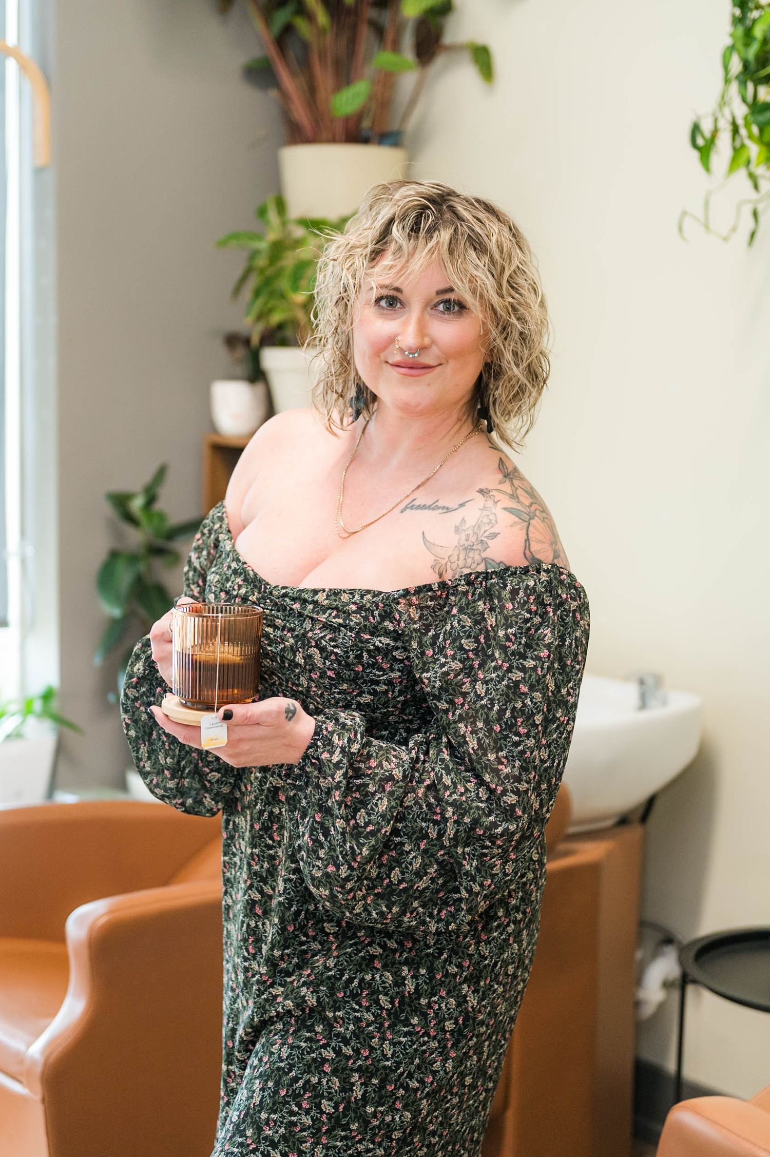 Indianapolis, Indiana hairstylist posing in her studio for a headshot during a salon branding session by Julie Loy Photography