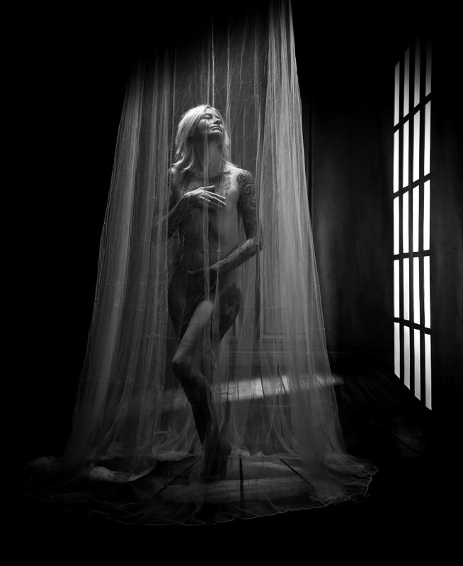 A series of black and white photos showing a ghostly figure dancing behind sheer curtains in dramatic lighting.