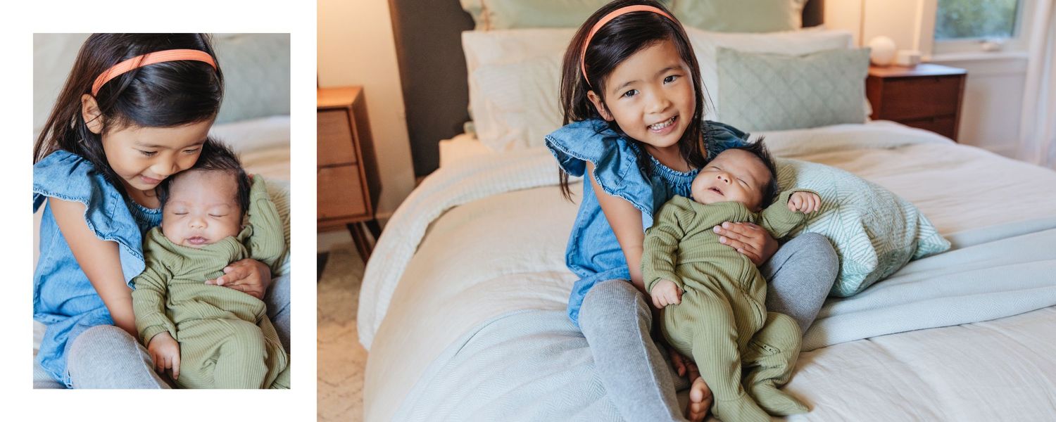Family relaxing together on white bedding during intimate photo session.