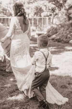 little boy holding his mother's wedding dress train, wedding photography, small weddings, Moncton, Riverview, Dieppe.