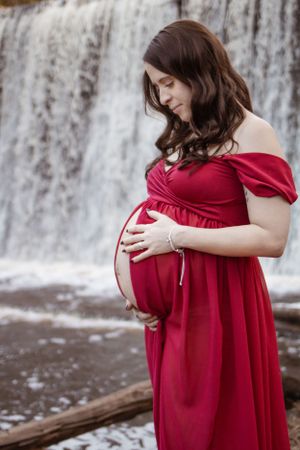 maternity photoshoot, expecting mom, maternity dress, looking at belly, hands on belly, maternity photographer, Moncton, Riverview, Dieppe.